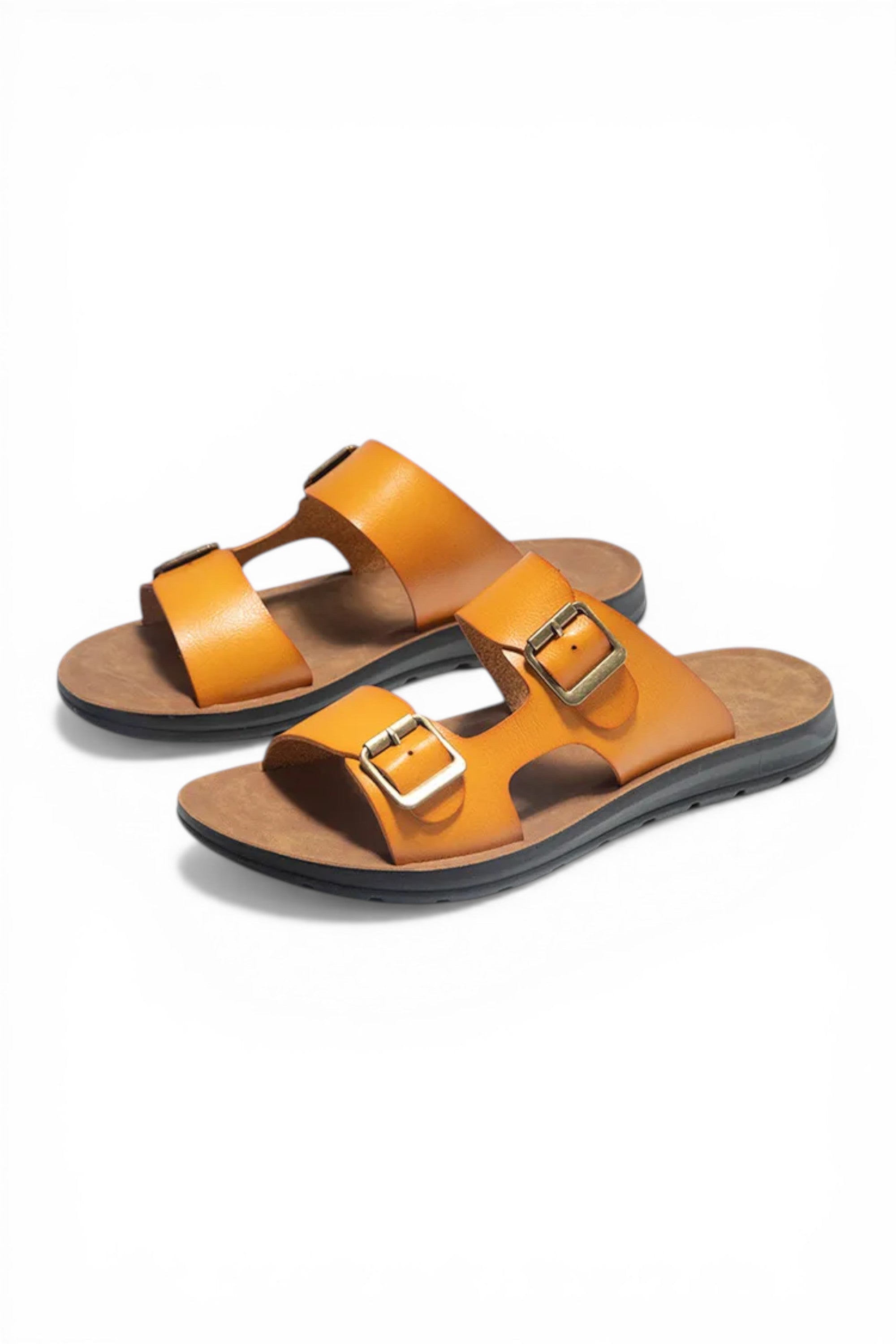 Pair of orange sandals with buckles on a white background
