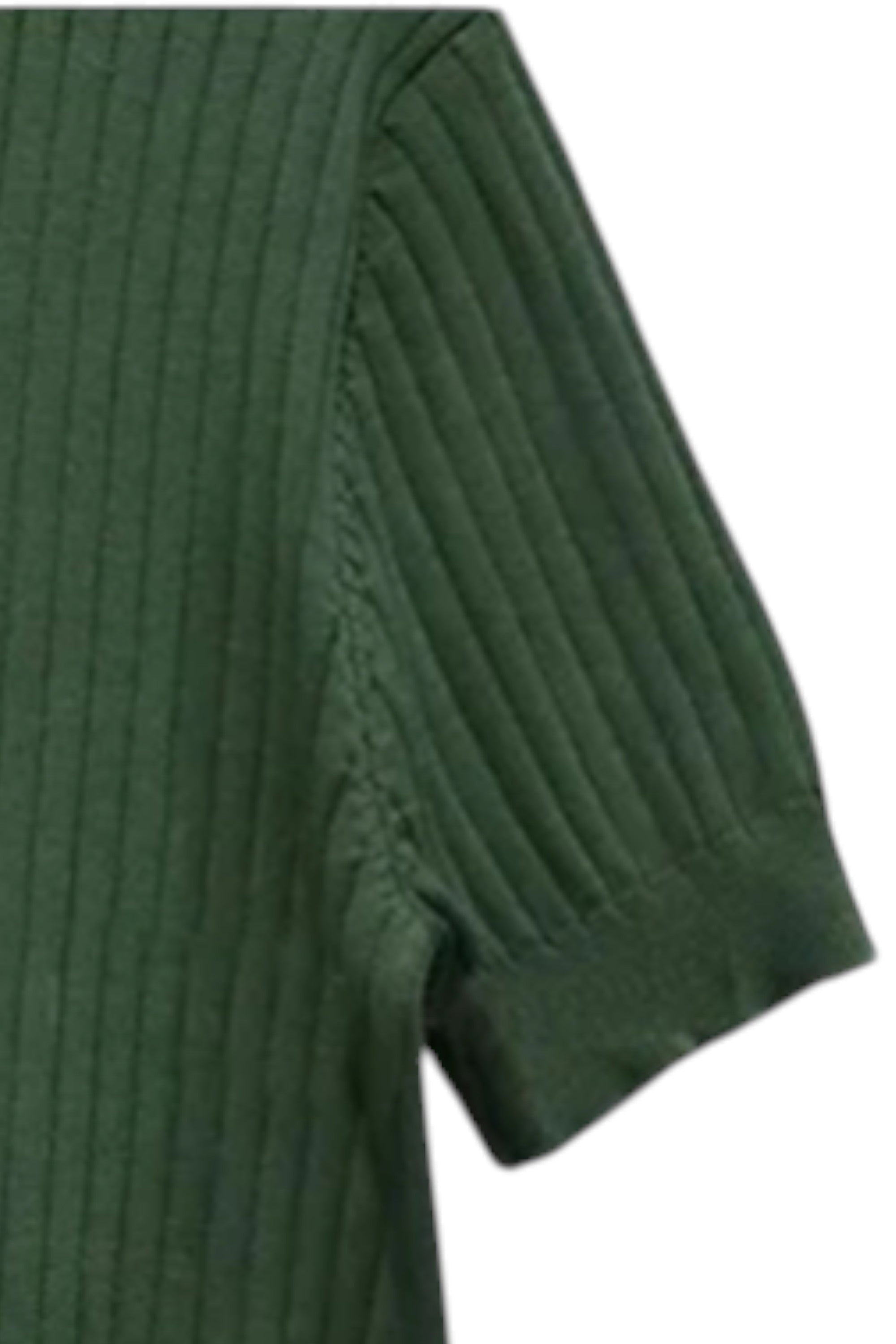 Close-up of a green ribbed sweater sleeve on a white background