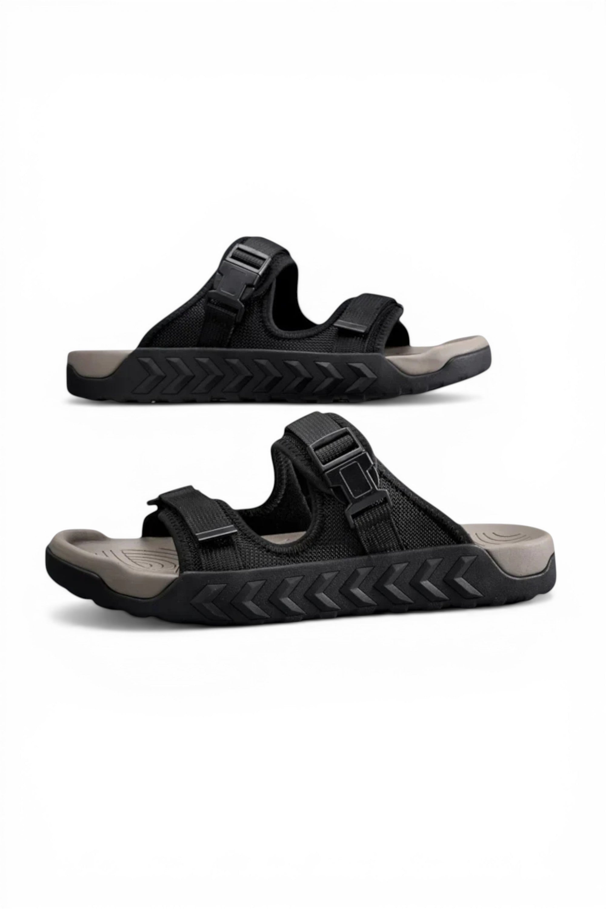 Black sandals with gray soles on a white background