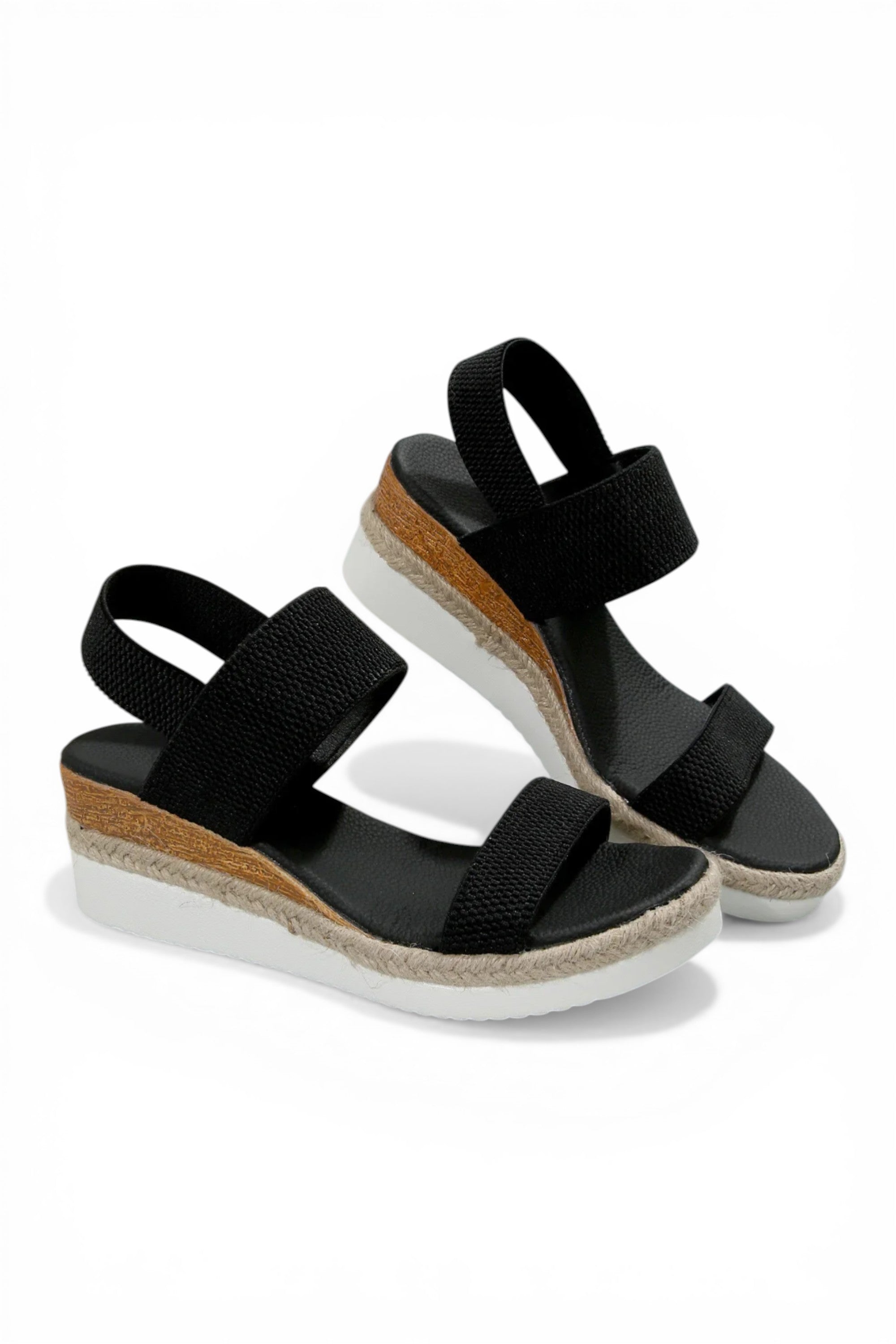 Black wedge sandals with cork sole on a white background