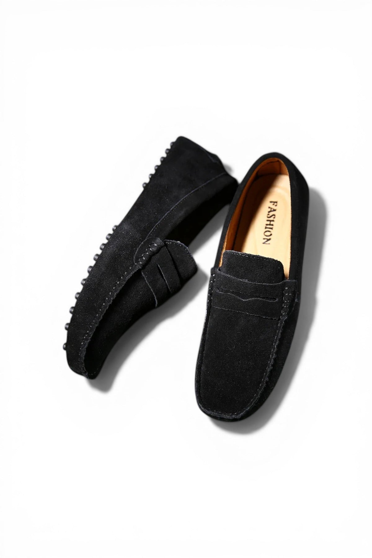 Black loafers on a white background