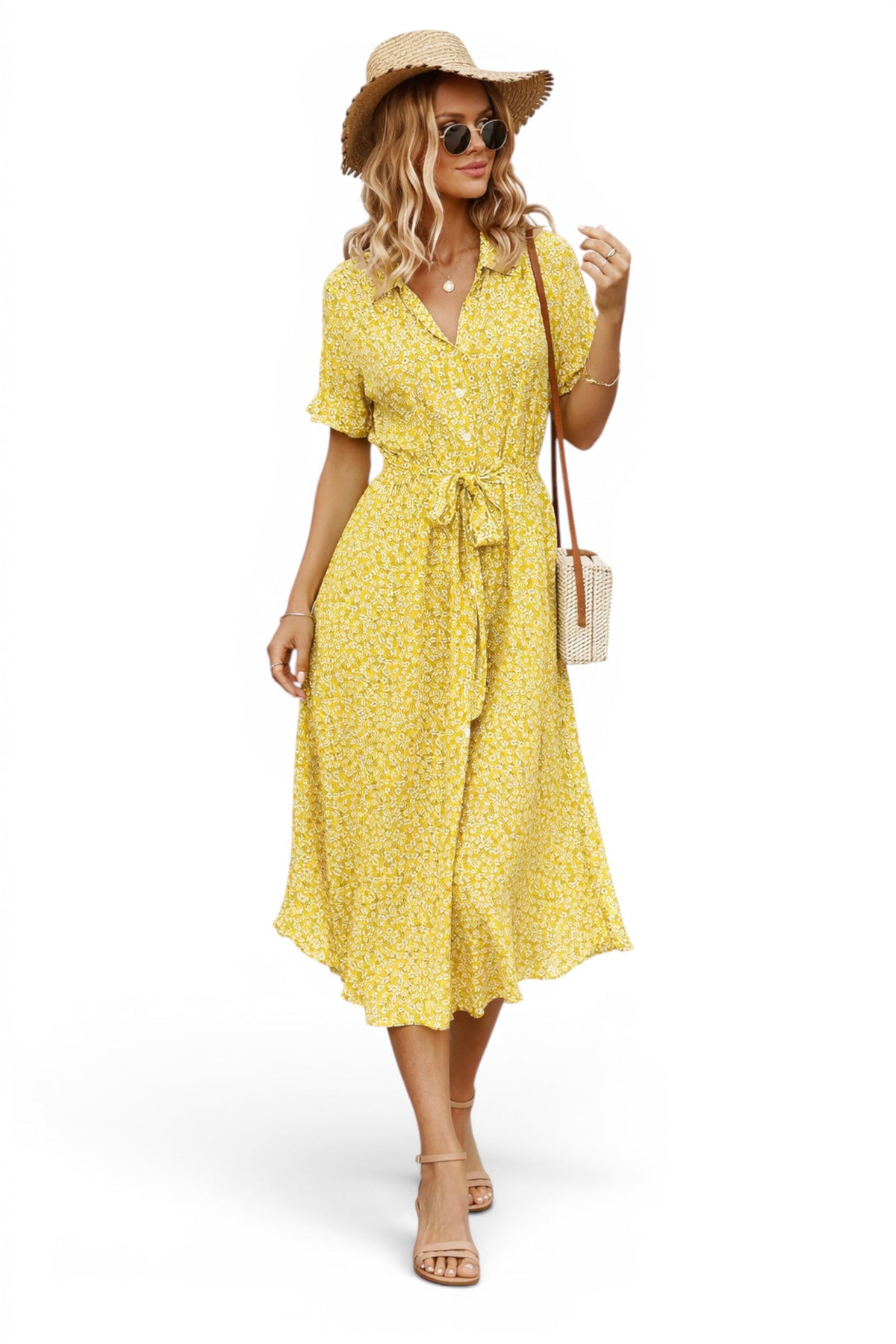Woman wearing a yellow dress with a straw hat and sunglasses on a white background