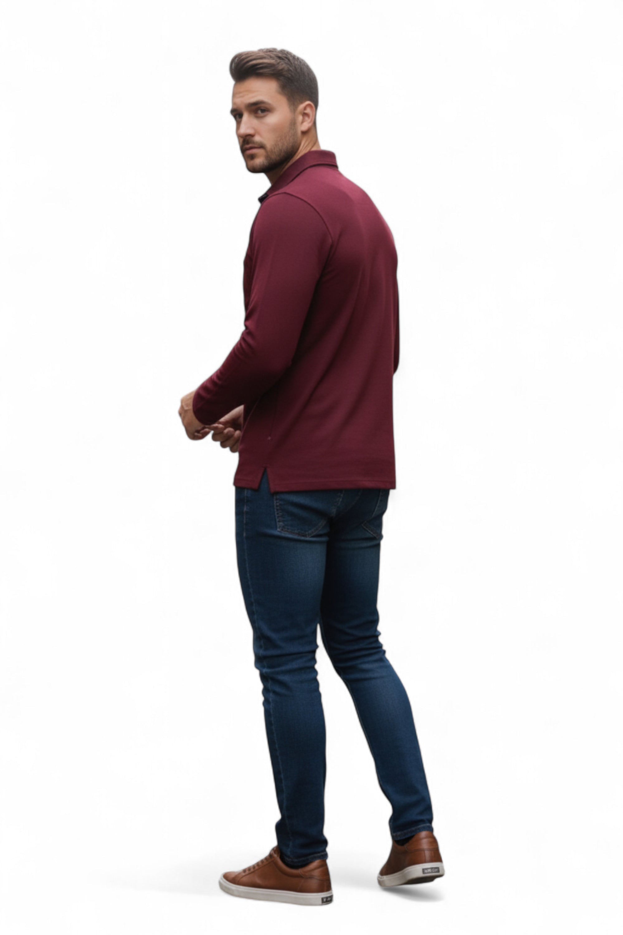 Man wearing a burgundy jacket and blue jeans on a white background