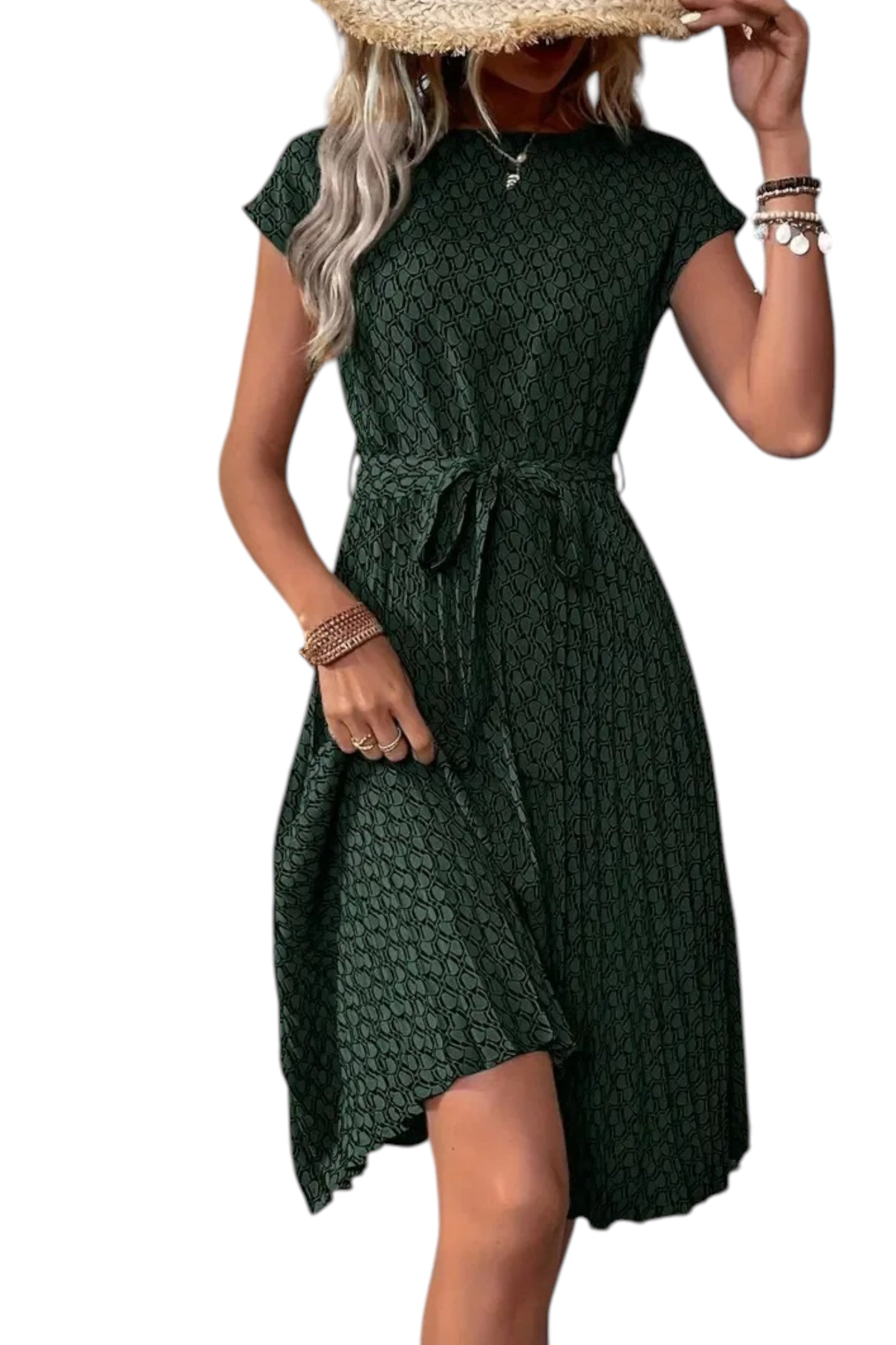 Woman wearing a green patterned dress with a white background