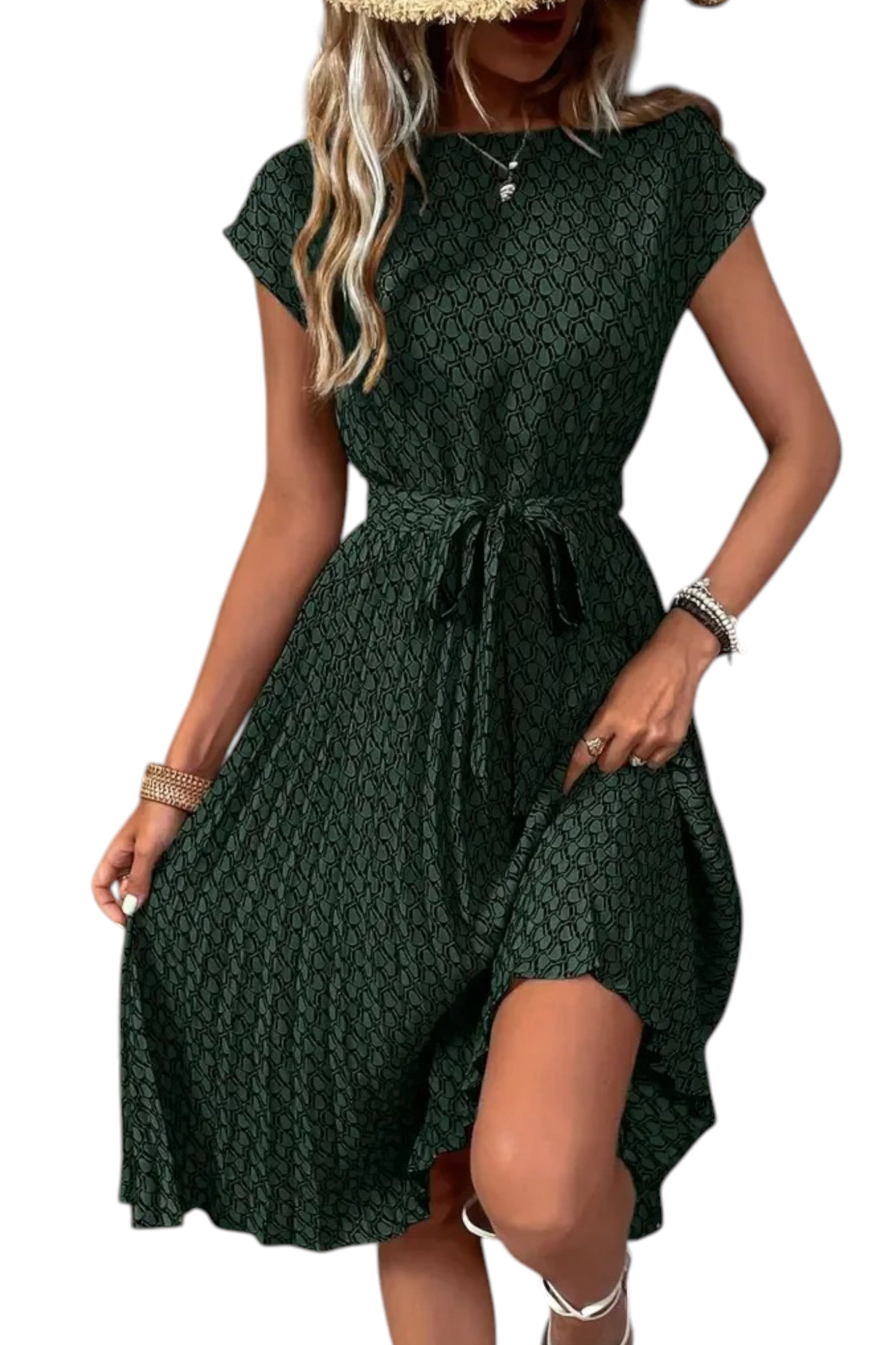 Green patterned dress worn by a model on a white background