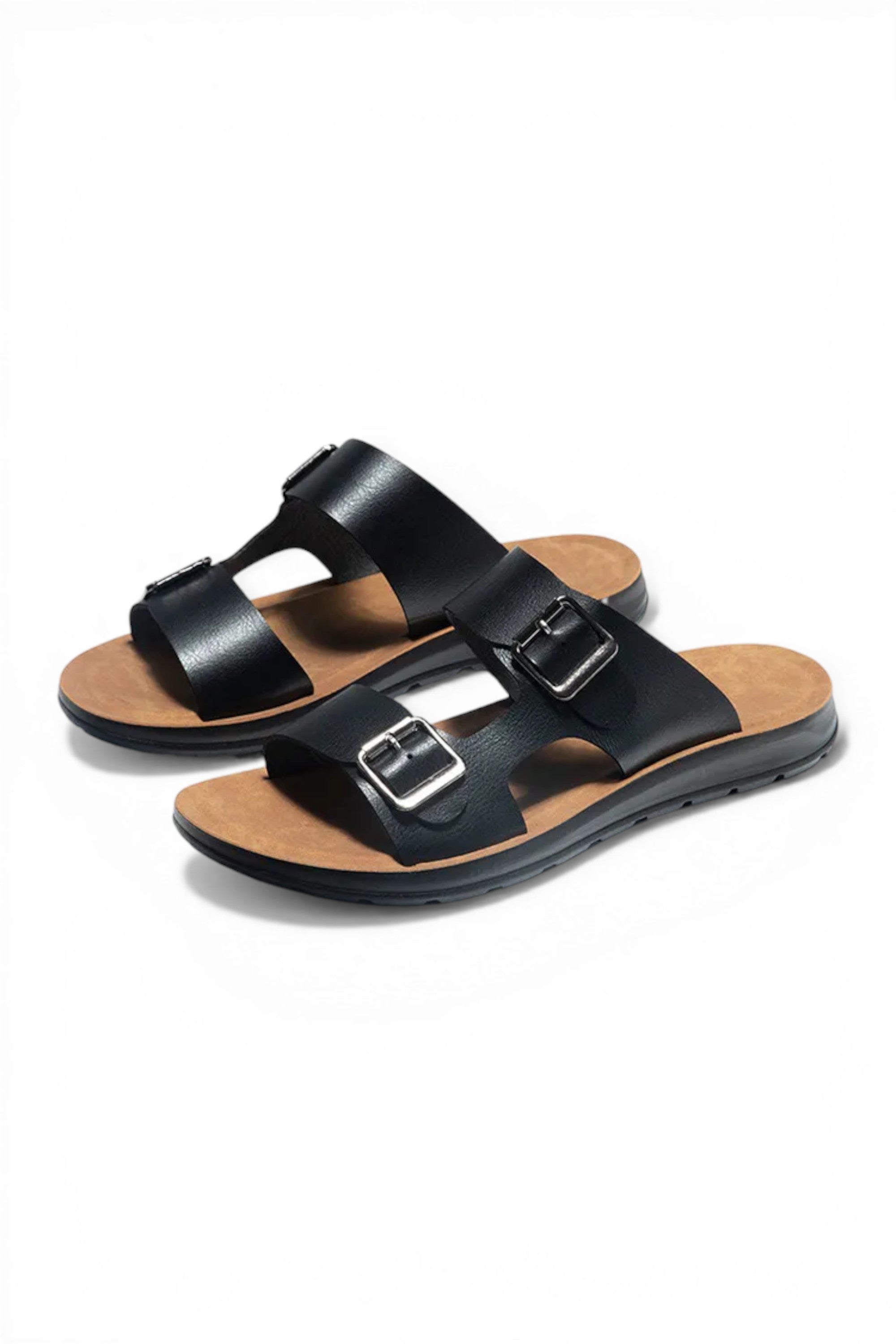 Black sandals with brown soles on a white background