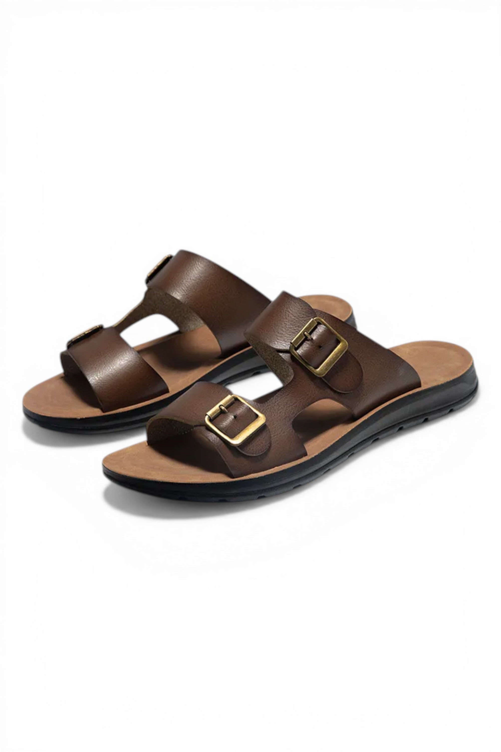 Pair of brown sandals with gold buckles on a white background