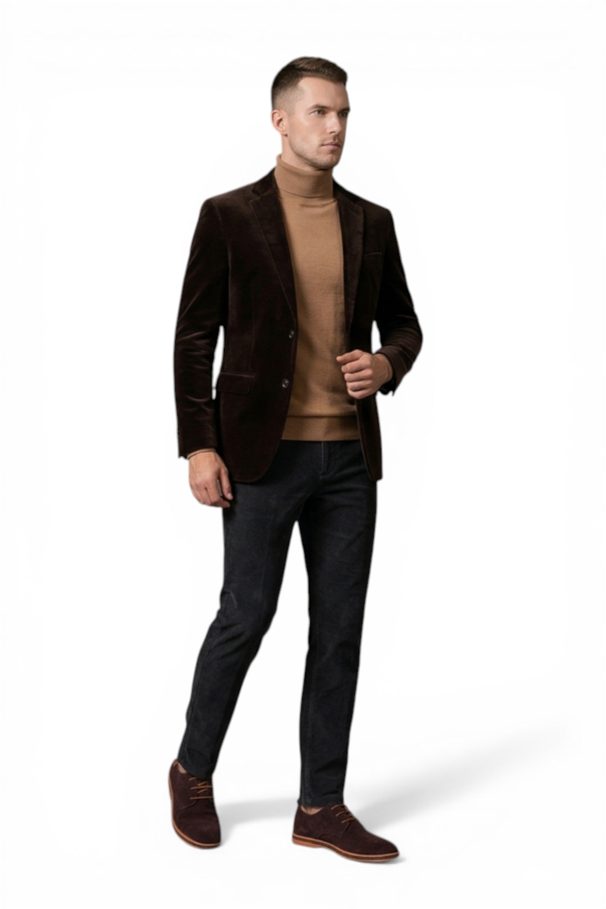 Man wearing a brown blazer, beige sweater, and black pants on a white background