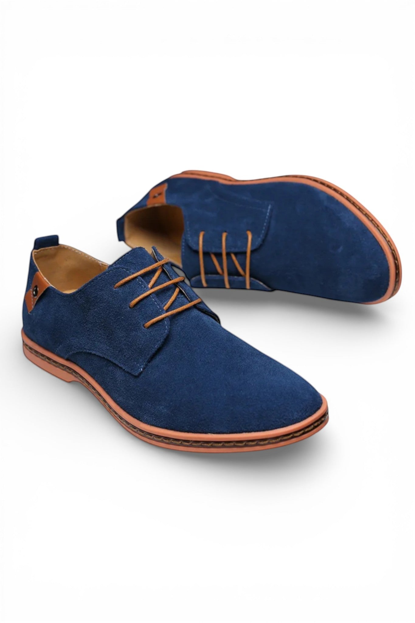 Blue suede shoes with brown accents on a white background