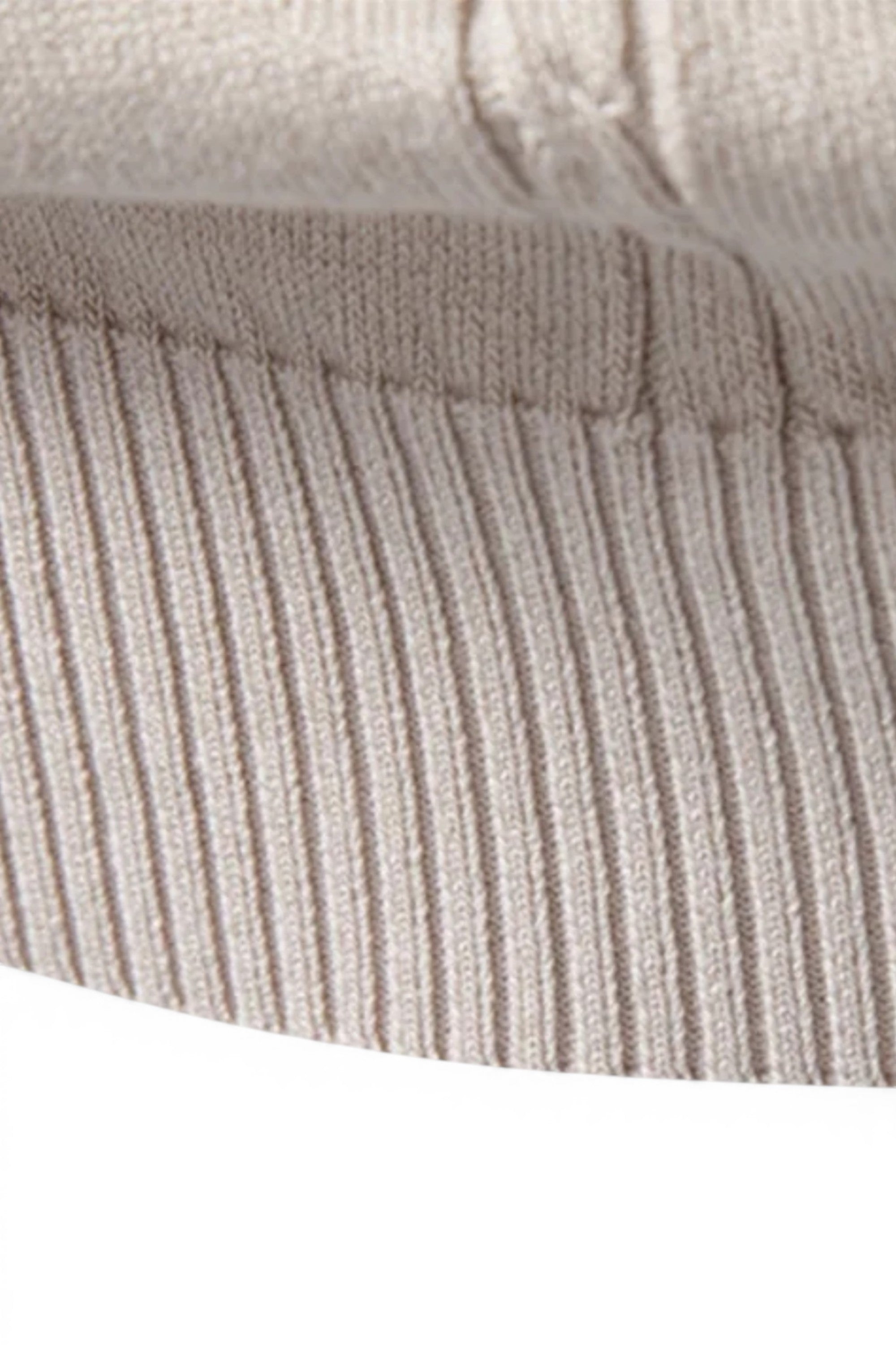 Close-up of a textured fabric surface with horizontal stripes.