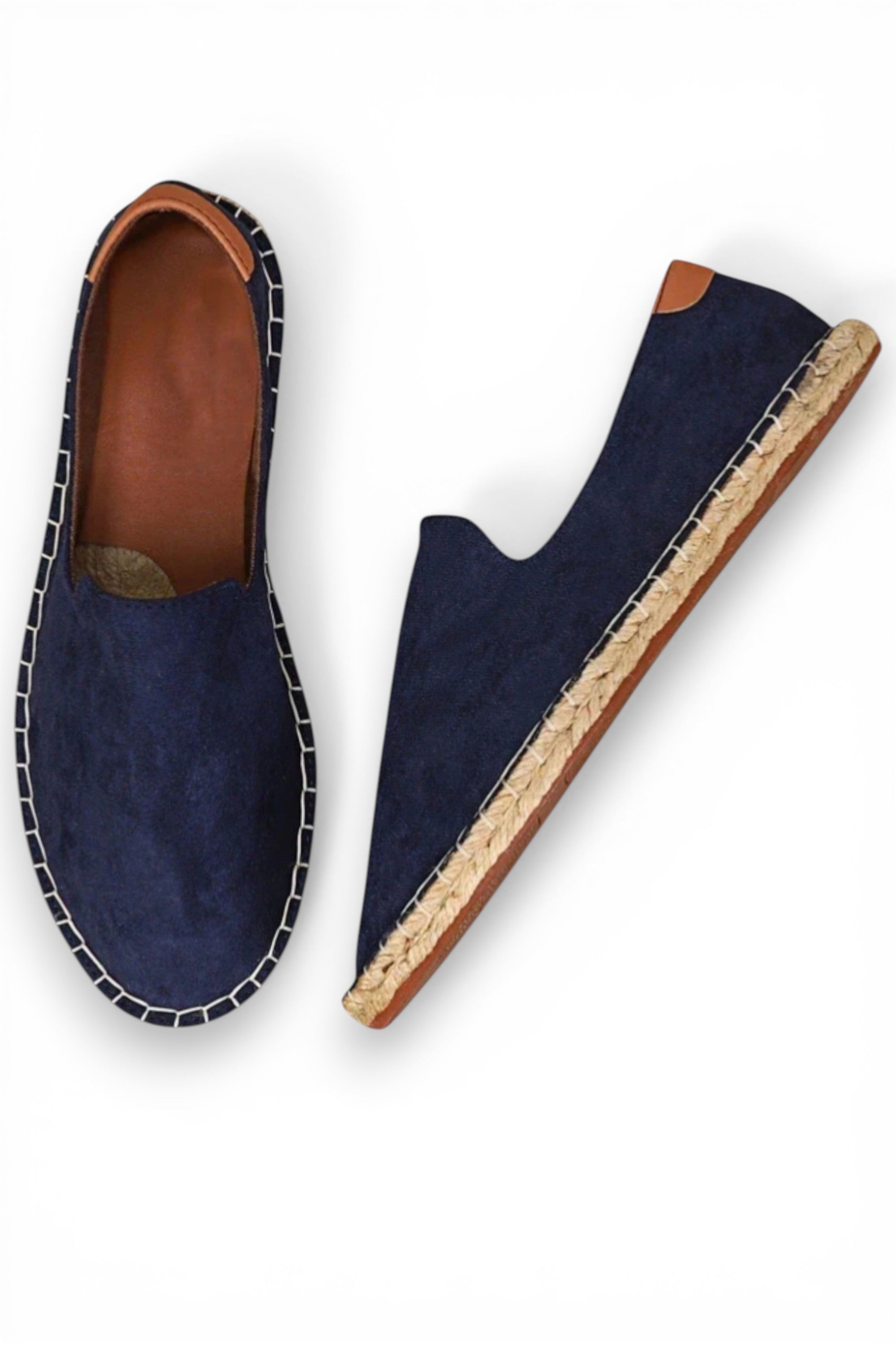 Navy blue espadrilles with brown soles on a white background