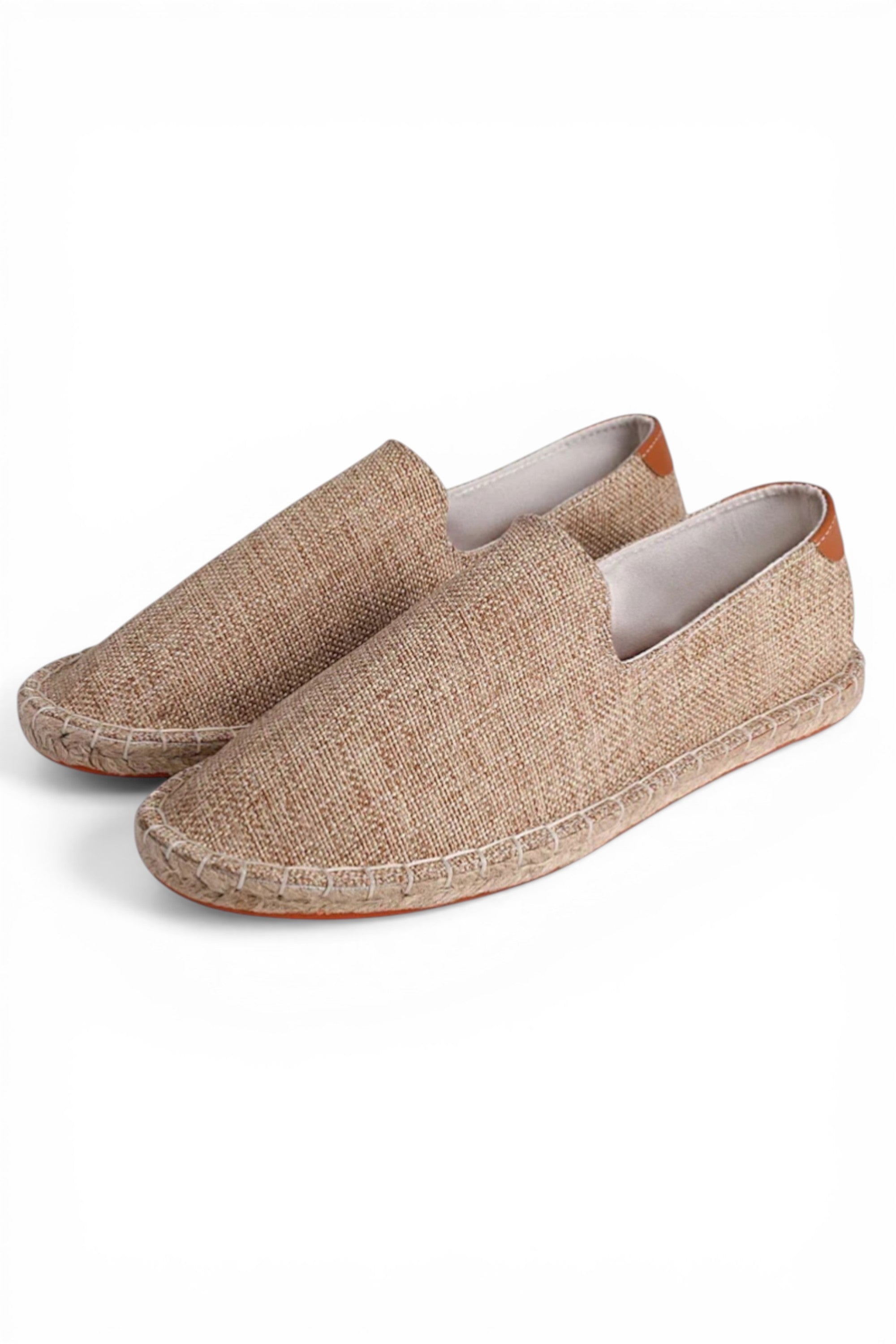 Pair of brown slip-on shoes on a white background