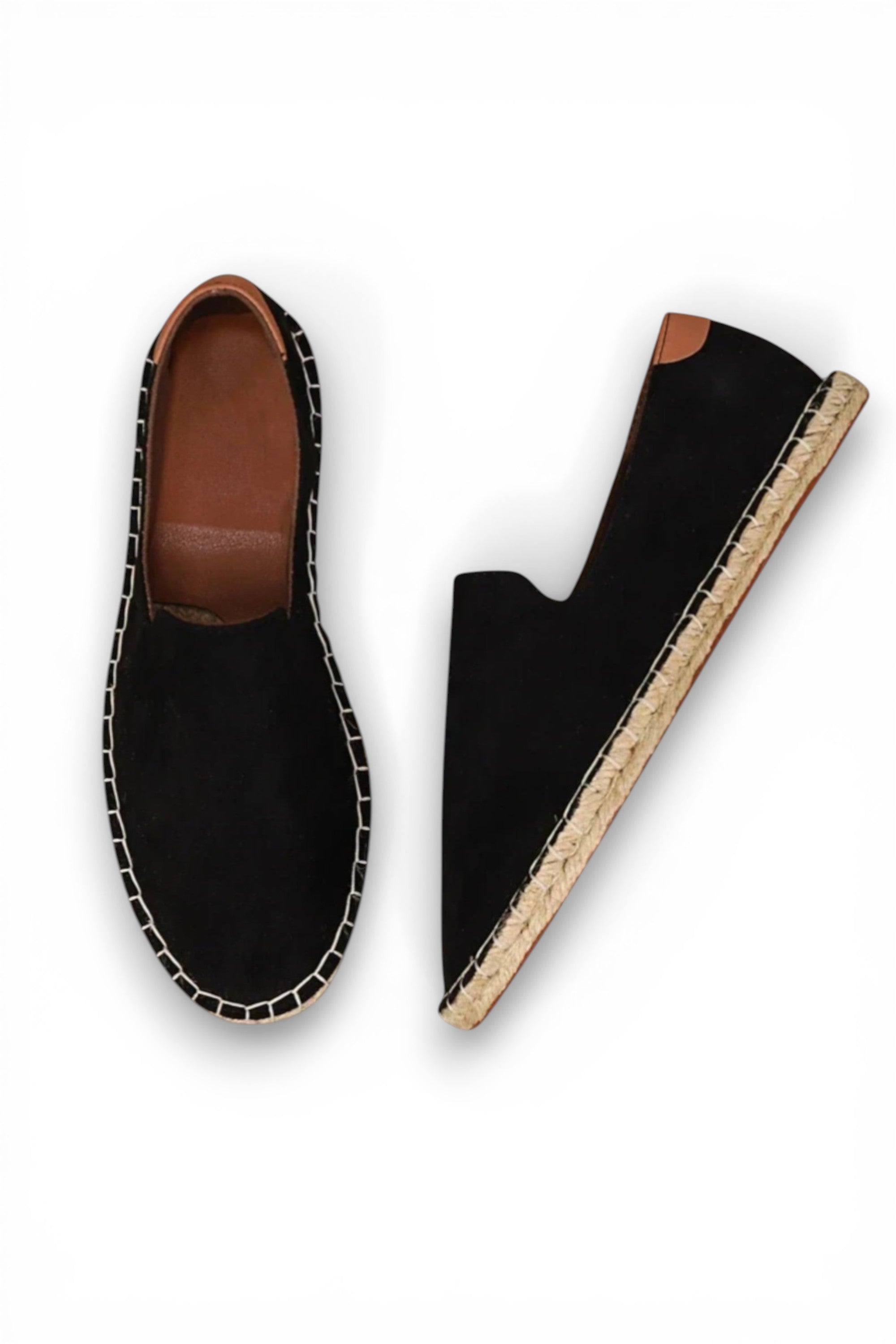 Black espadrille shoes with brown soles on a white background