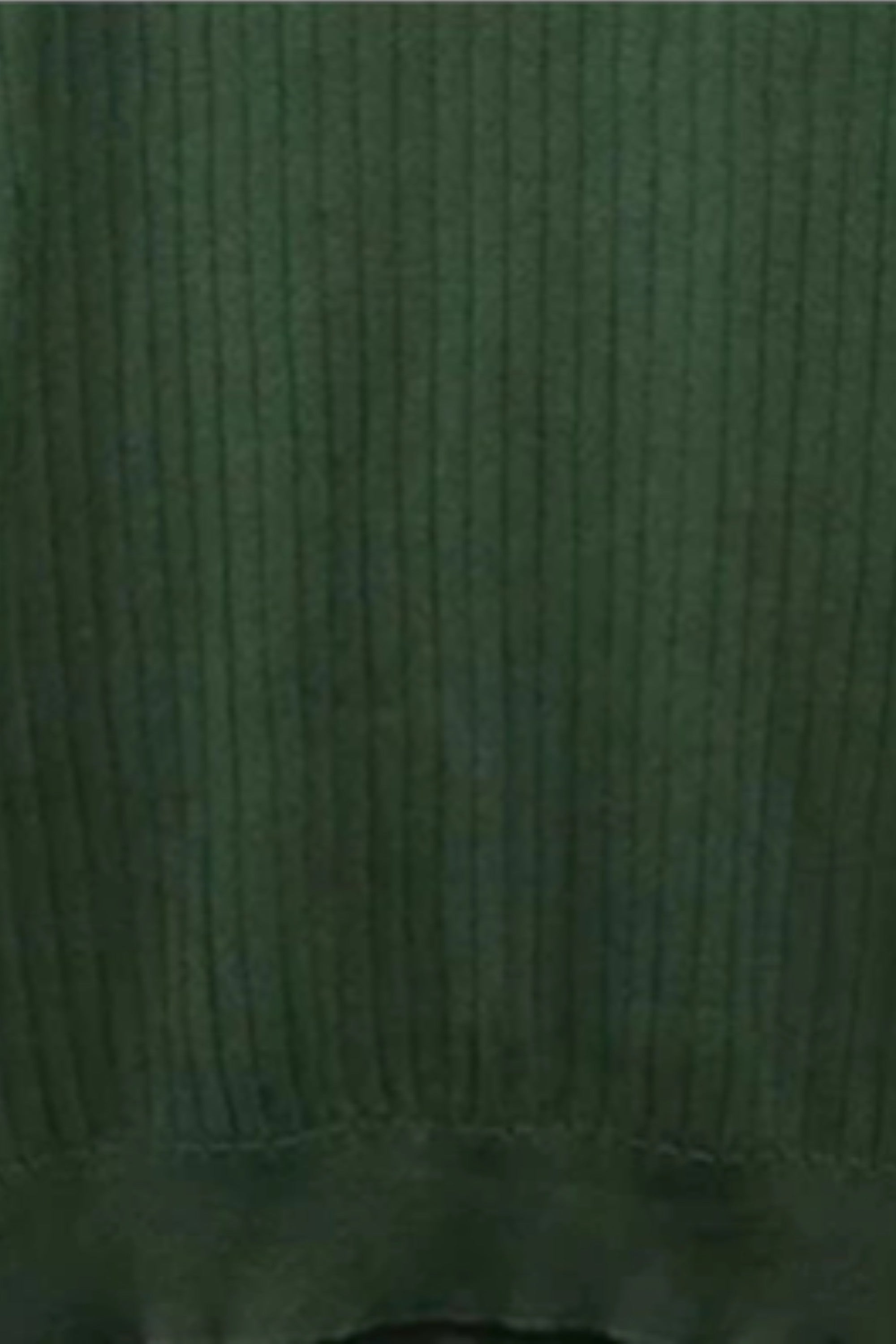 Close-up of a textured green fabric surface