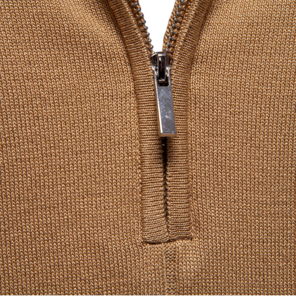 Close-up of a brown zip-up polo shirt with a metal zipper on a white background