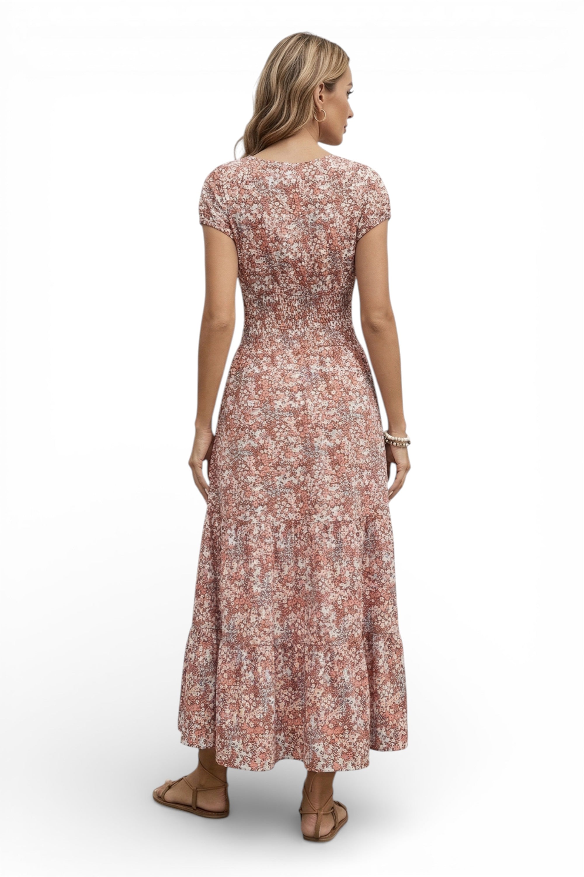 Woman wearing a floral dress on a white background