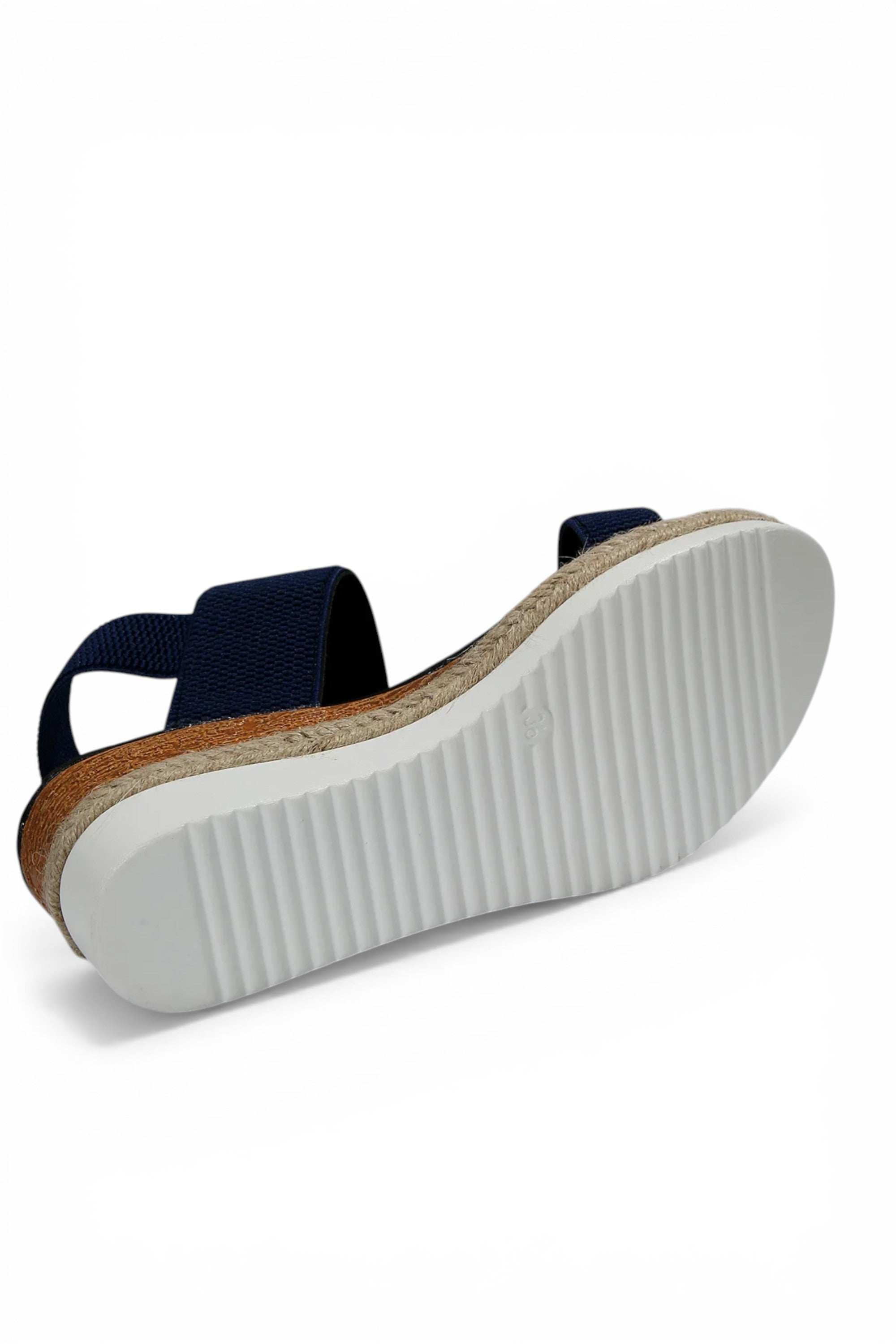 Navy sandal with a white sole on a white background