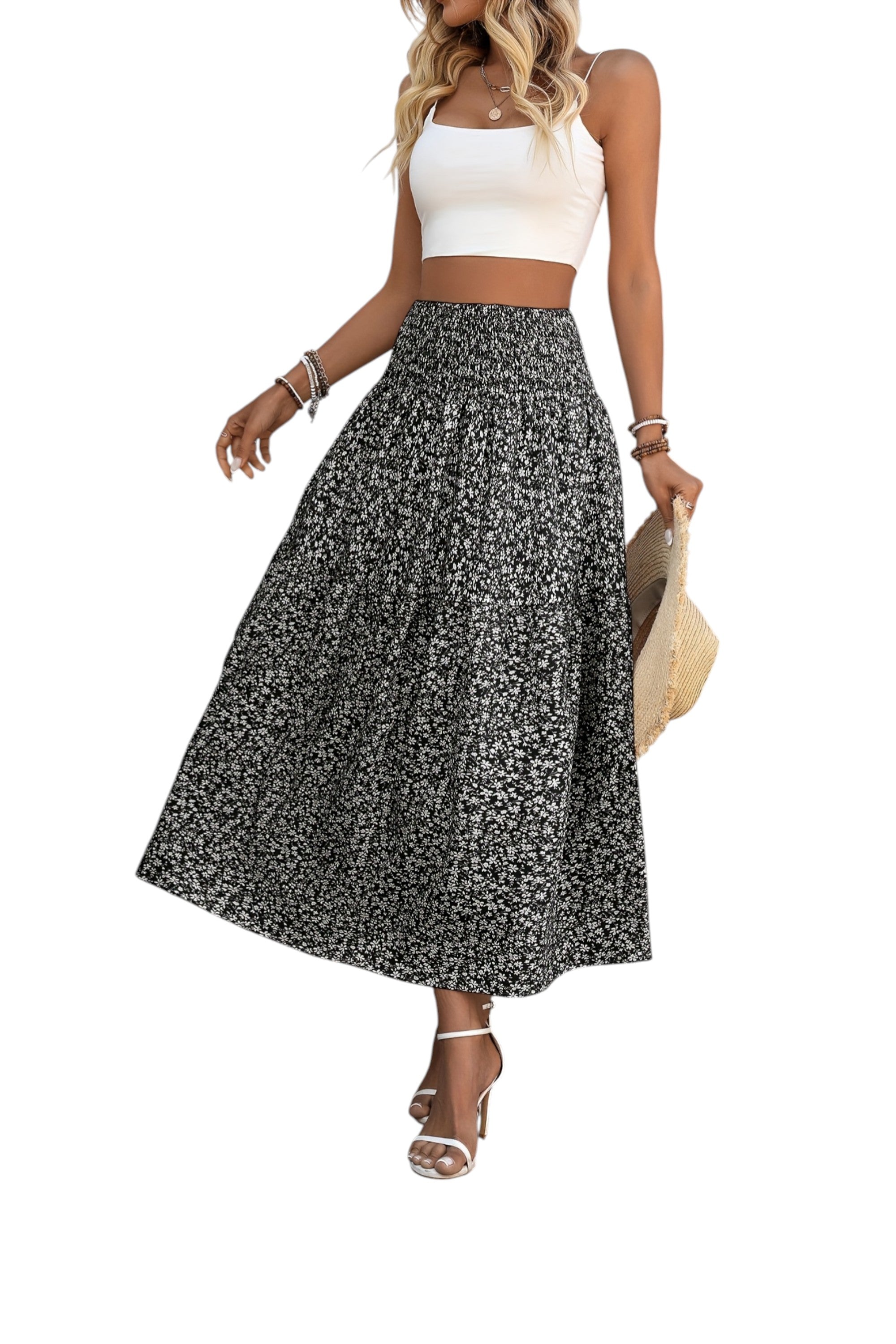 Woman wearing a white top and black floral skirt on a white background