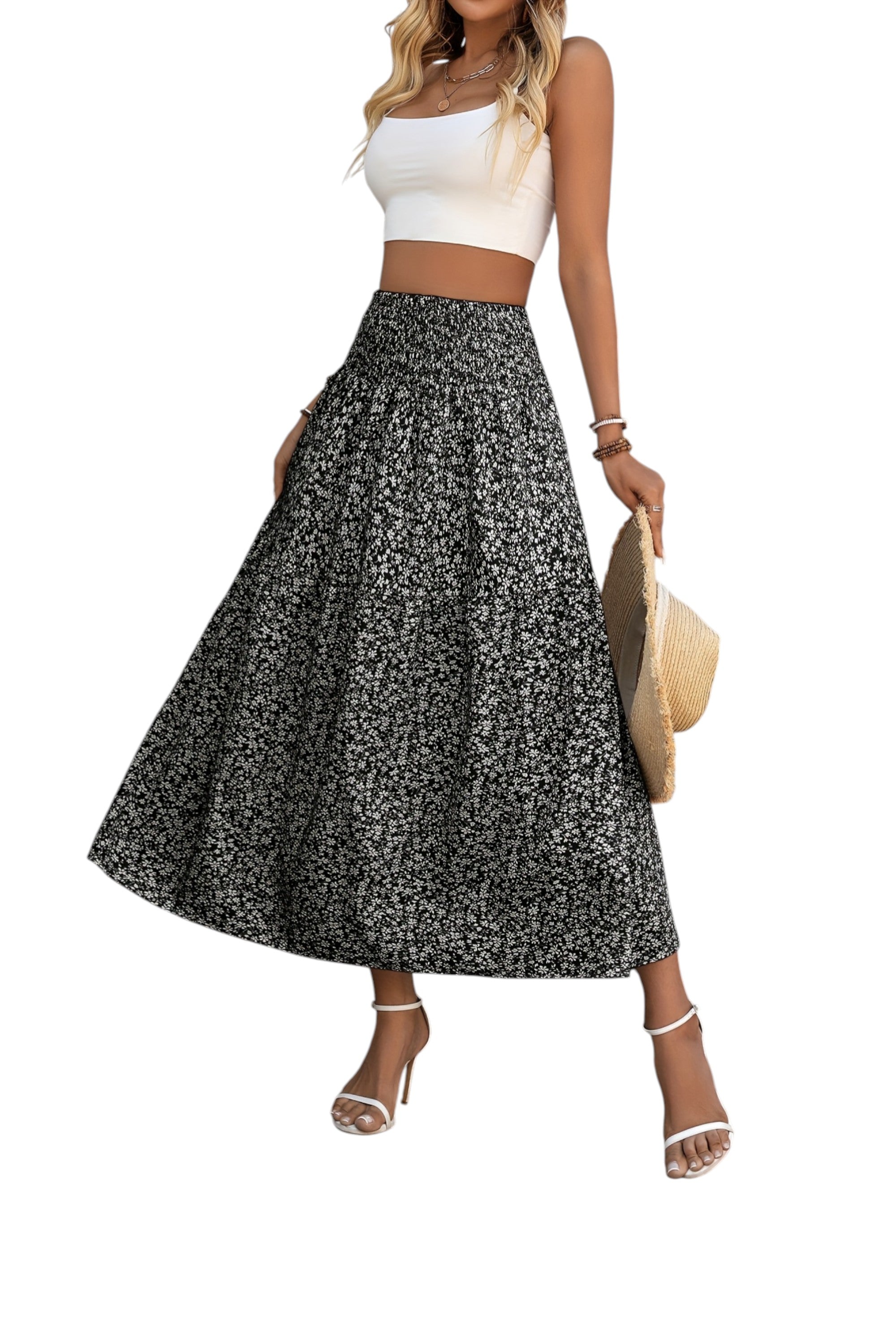 Woman wearing a floral skirt and white top on a white background