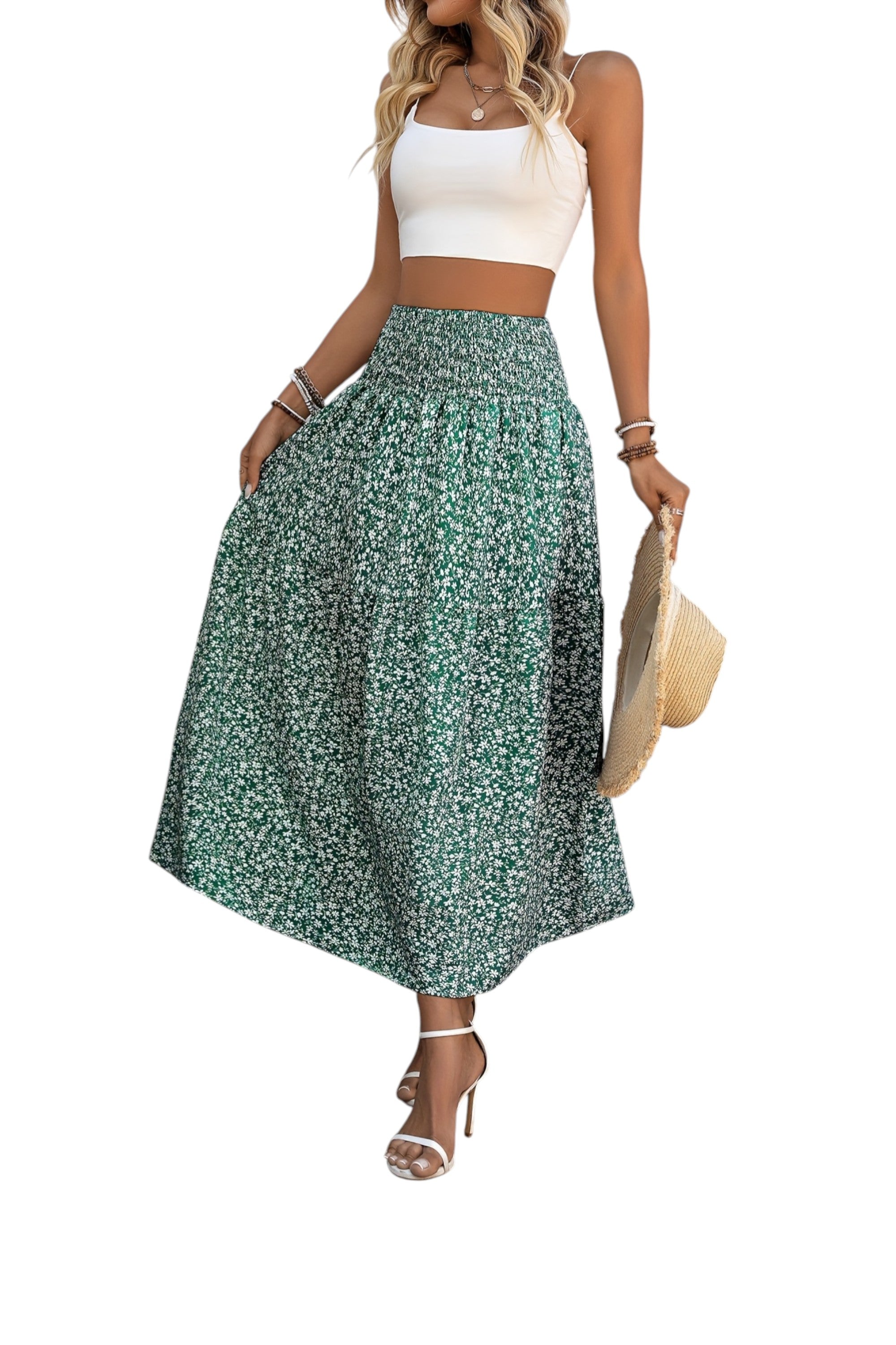 Woman wearing a white top and green floral skirt on a white background