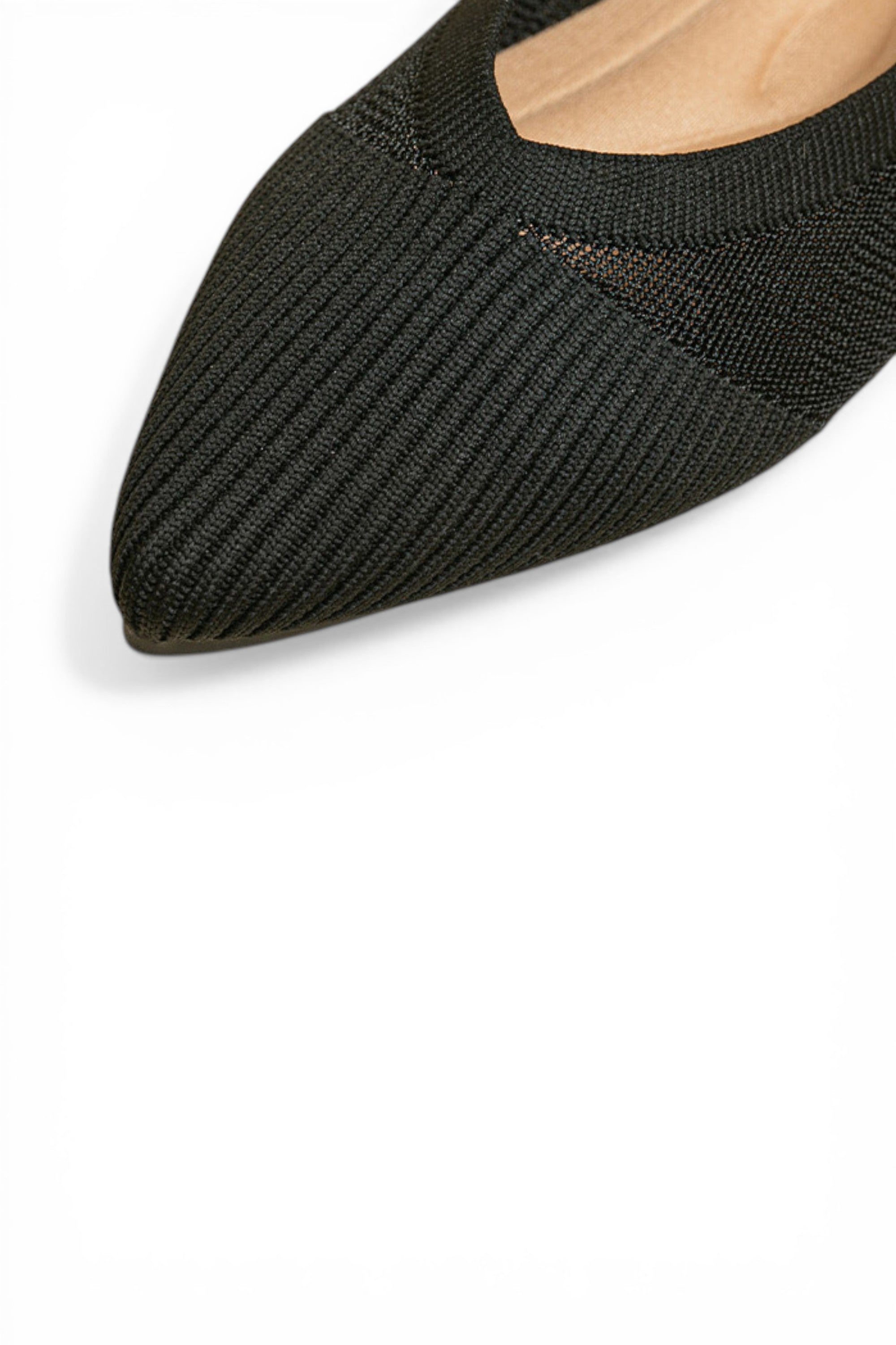 Black pointed-toe shoe on a white background