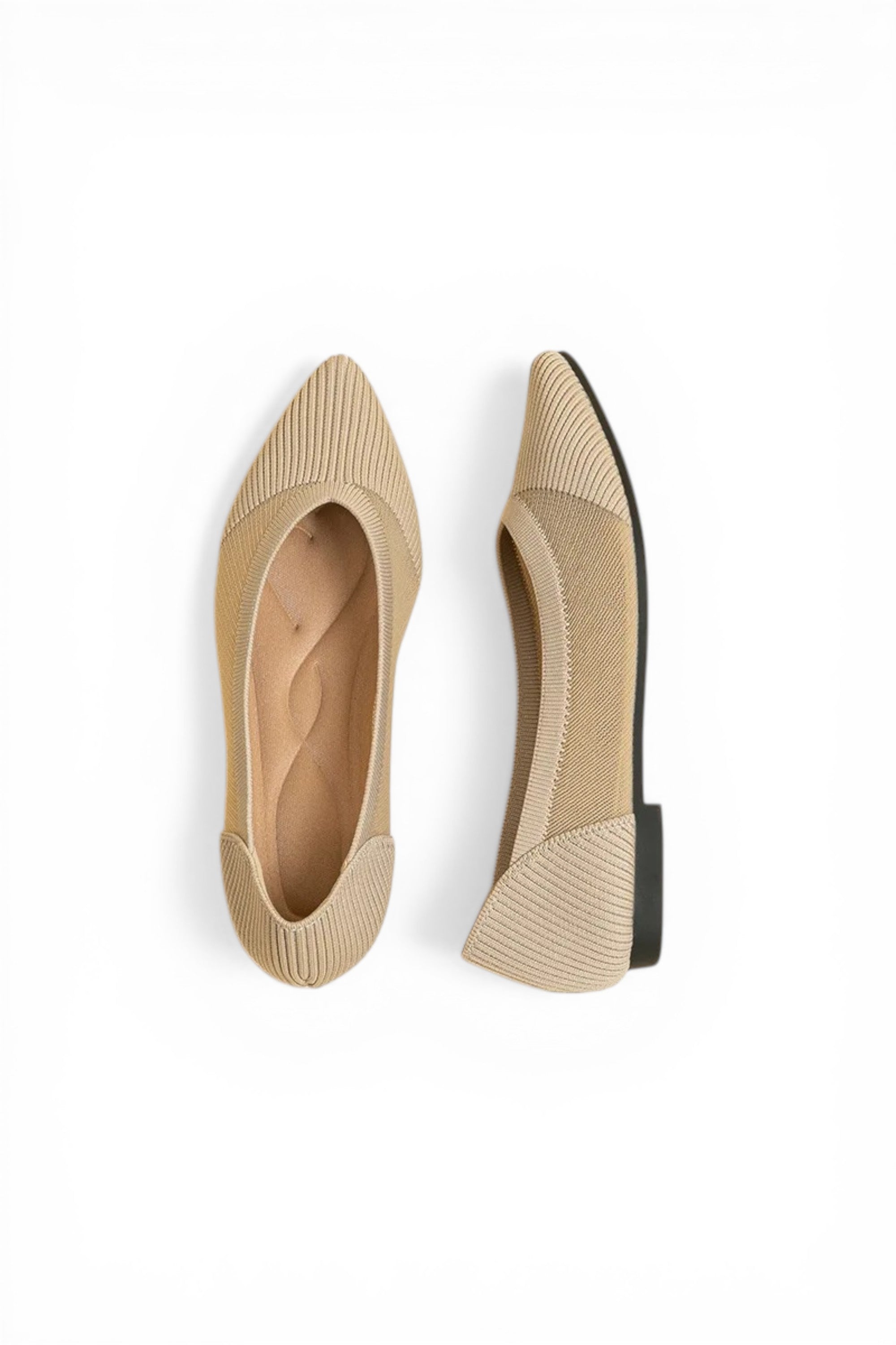 Pair of beige pointed-toe shoes on a white background