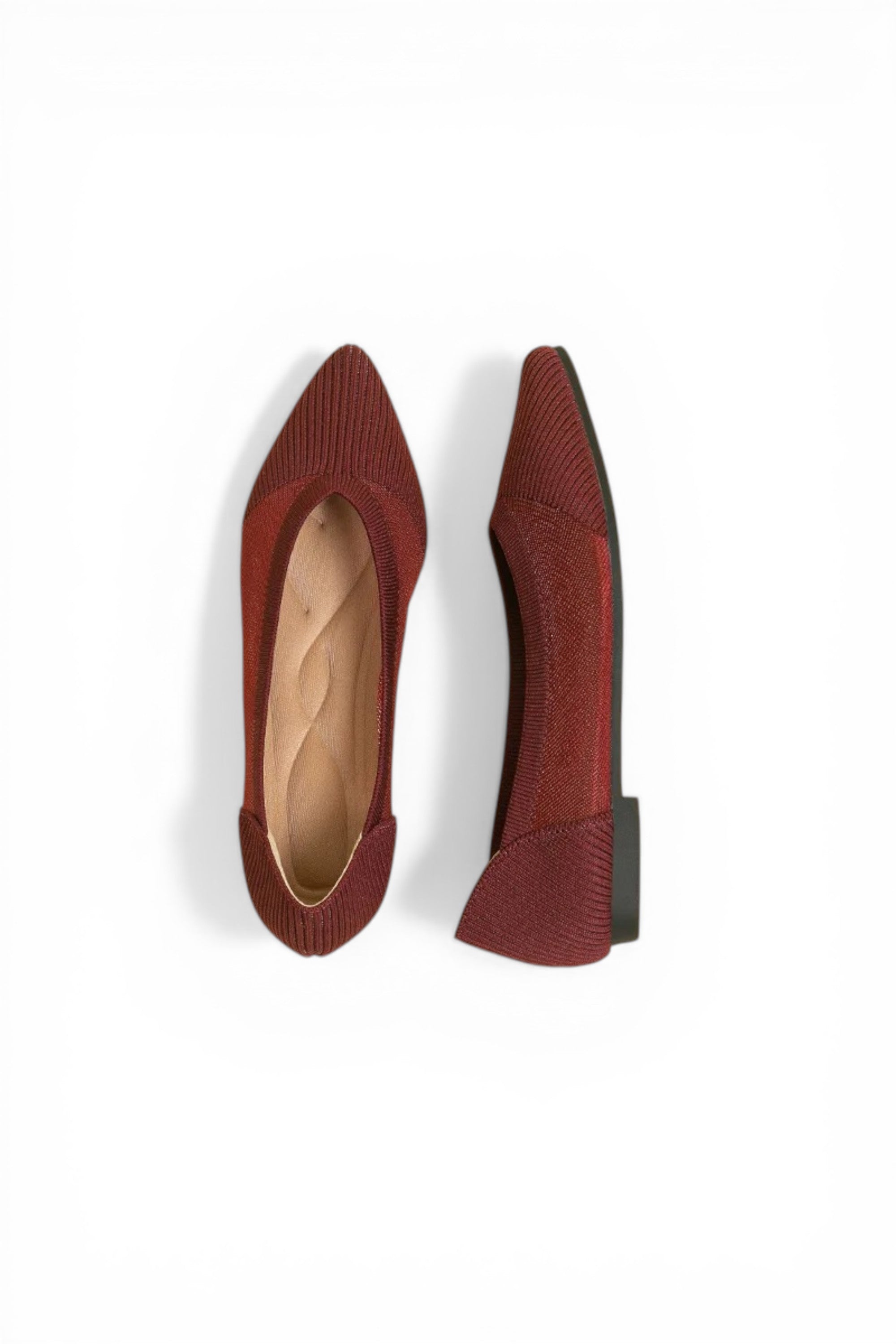 Pair of red pointed-toe shoes on a white background