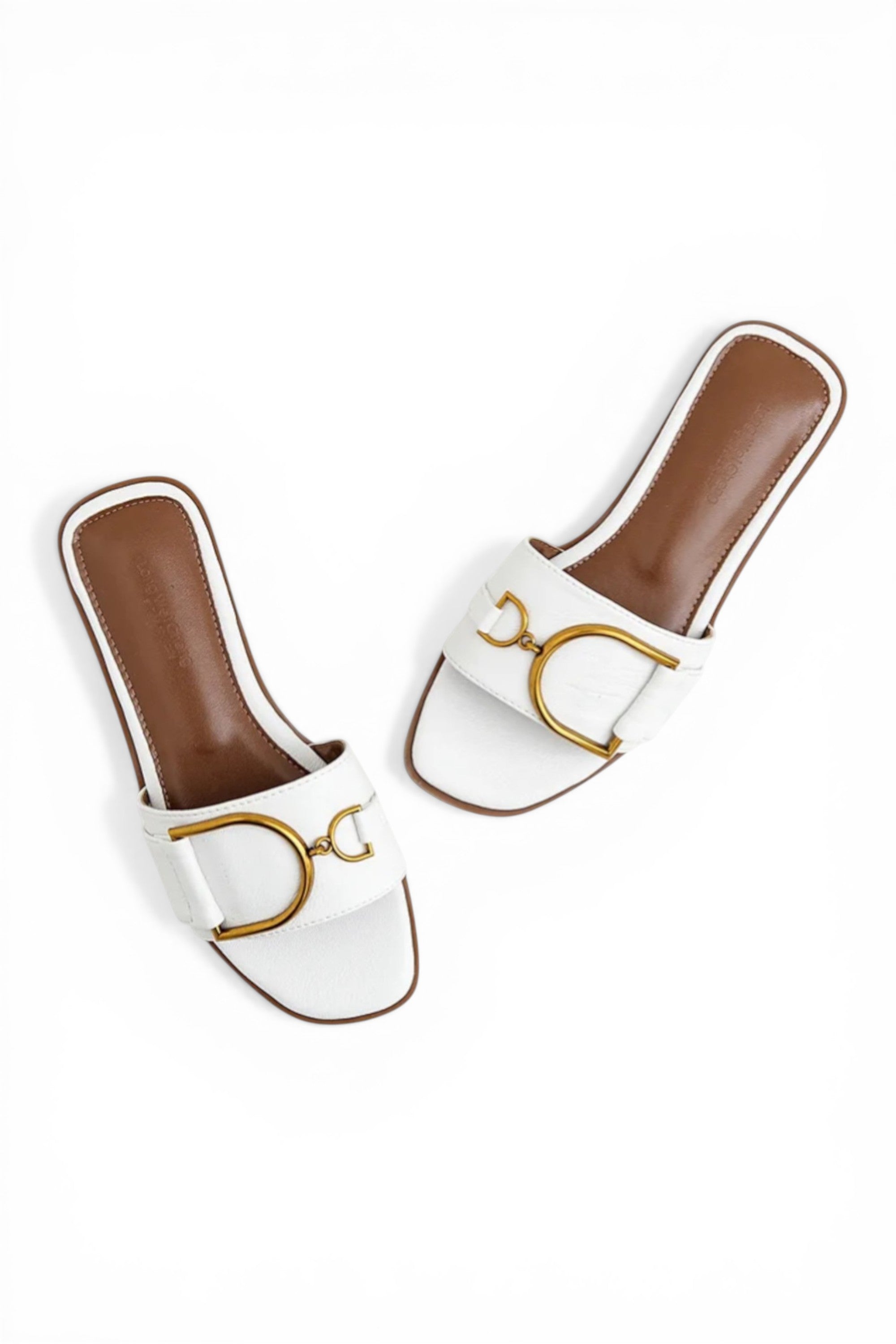 White slides with brown soles and gold logo on a white background
