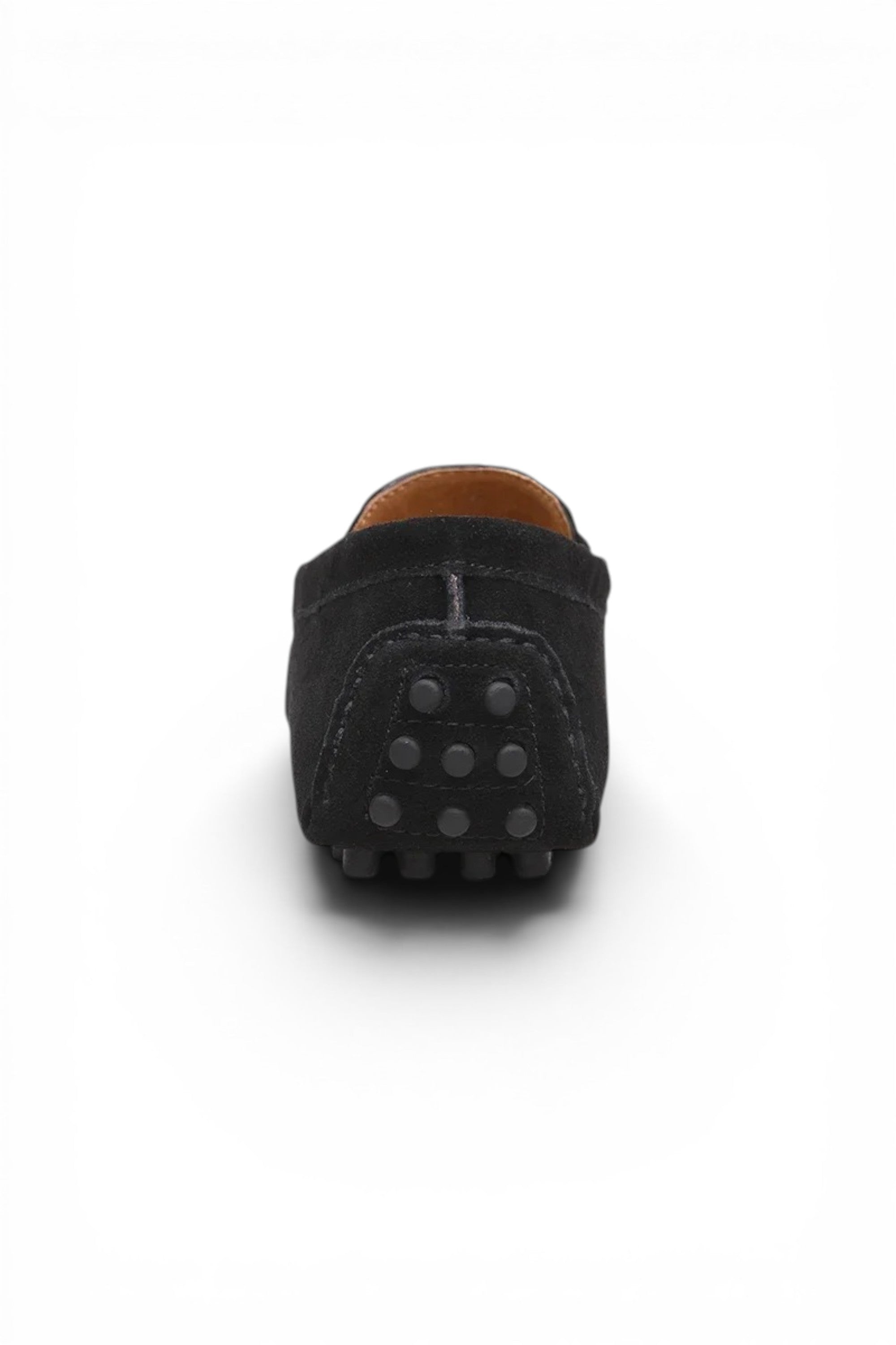 Black slip-on shoe with a brown sole on a white background