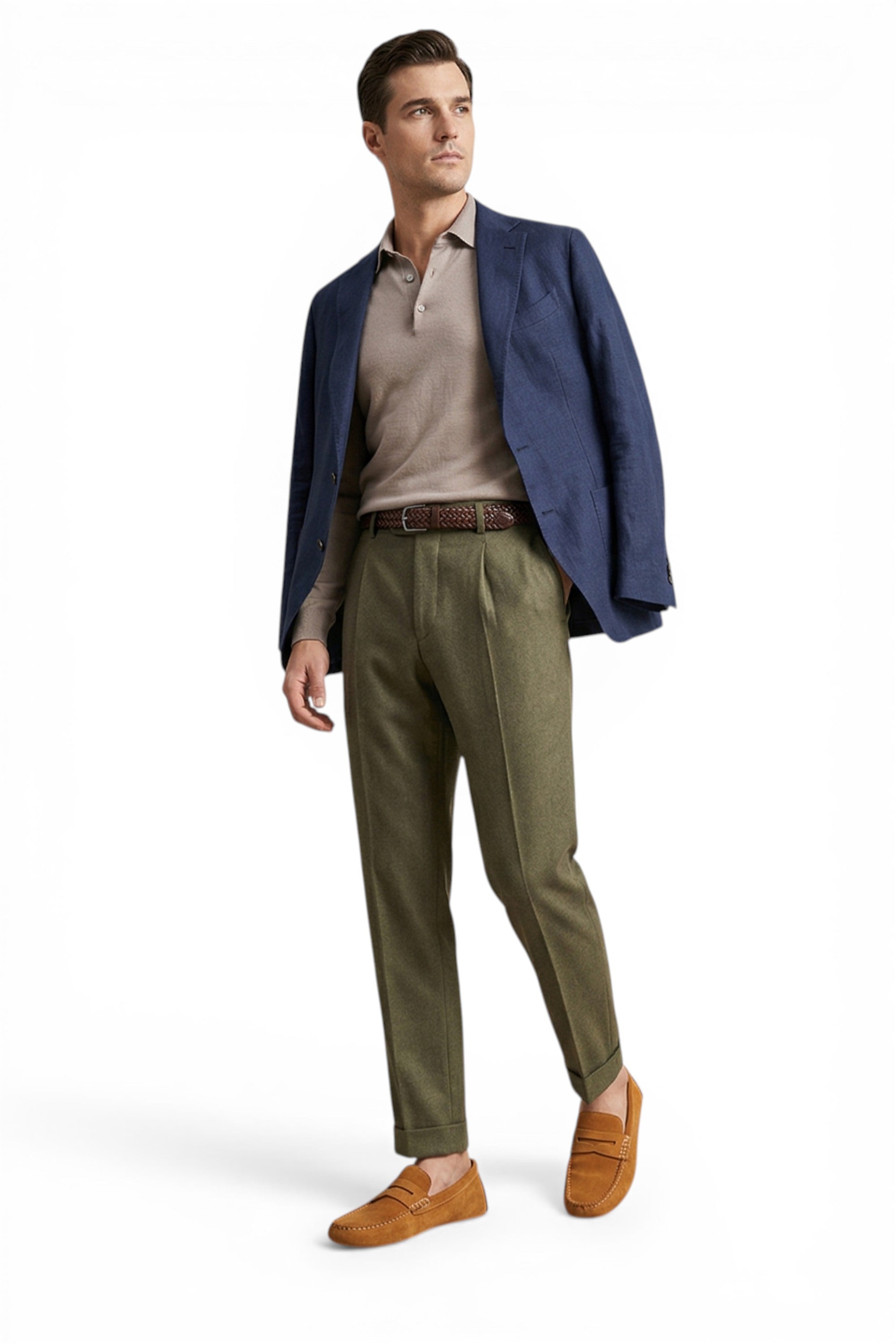 Man wearing a blue blazer, beige shirt, green pants, and brown shoes on a white background