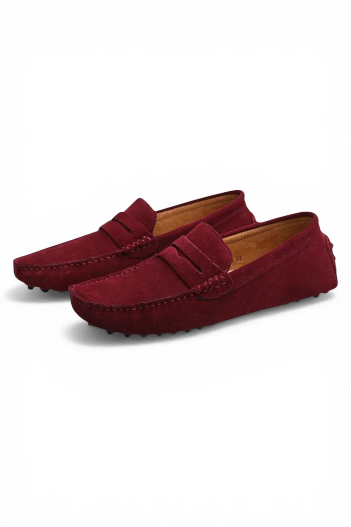 Pair of red loafers on a white background