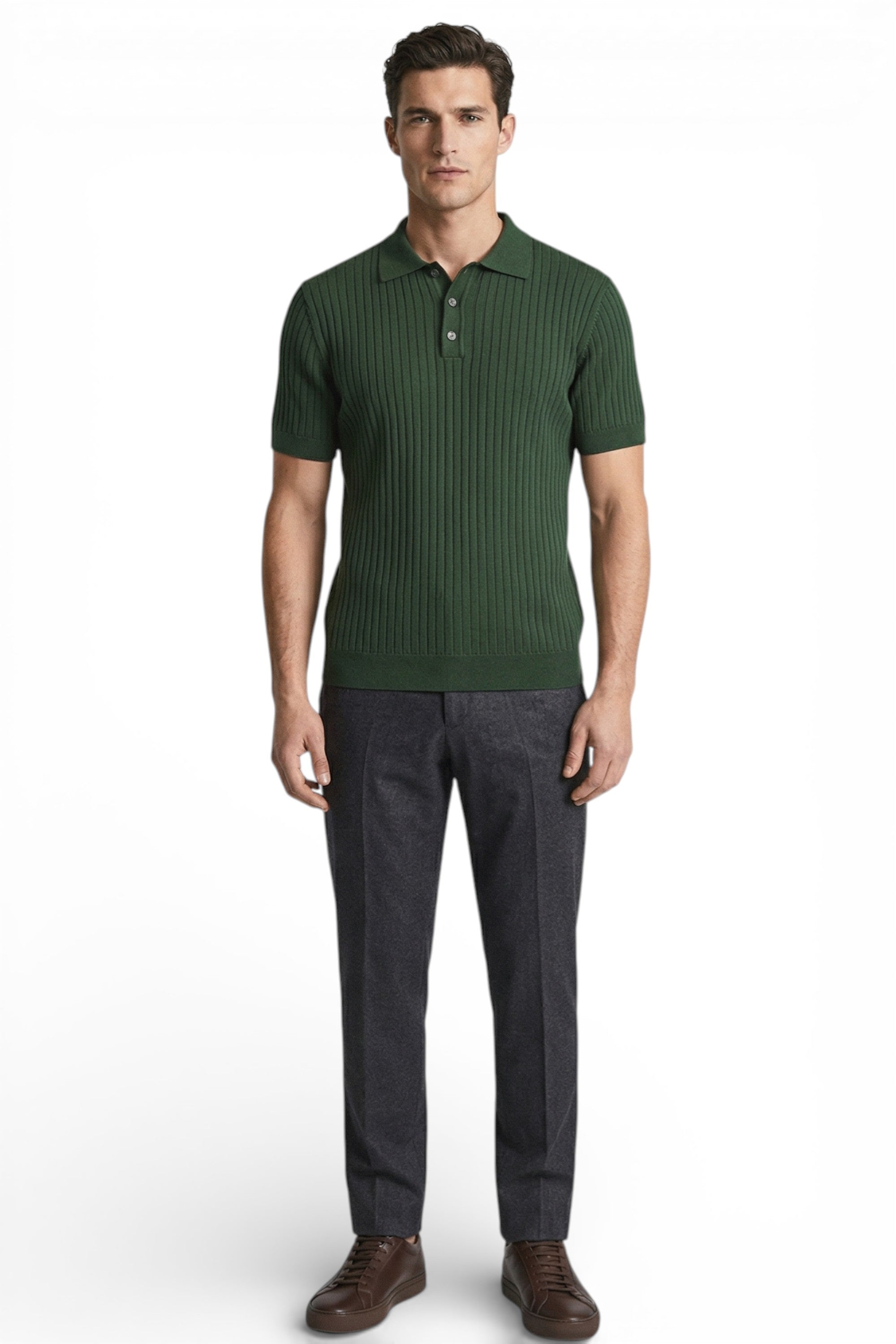 Man wearing a green ribbed polo shirt and dark gray pants on a white background